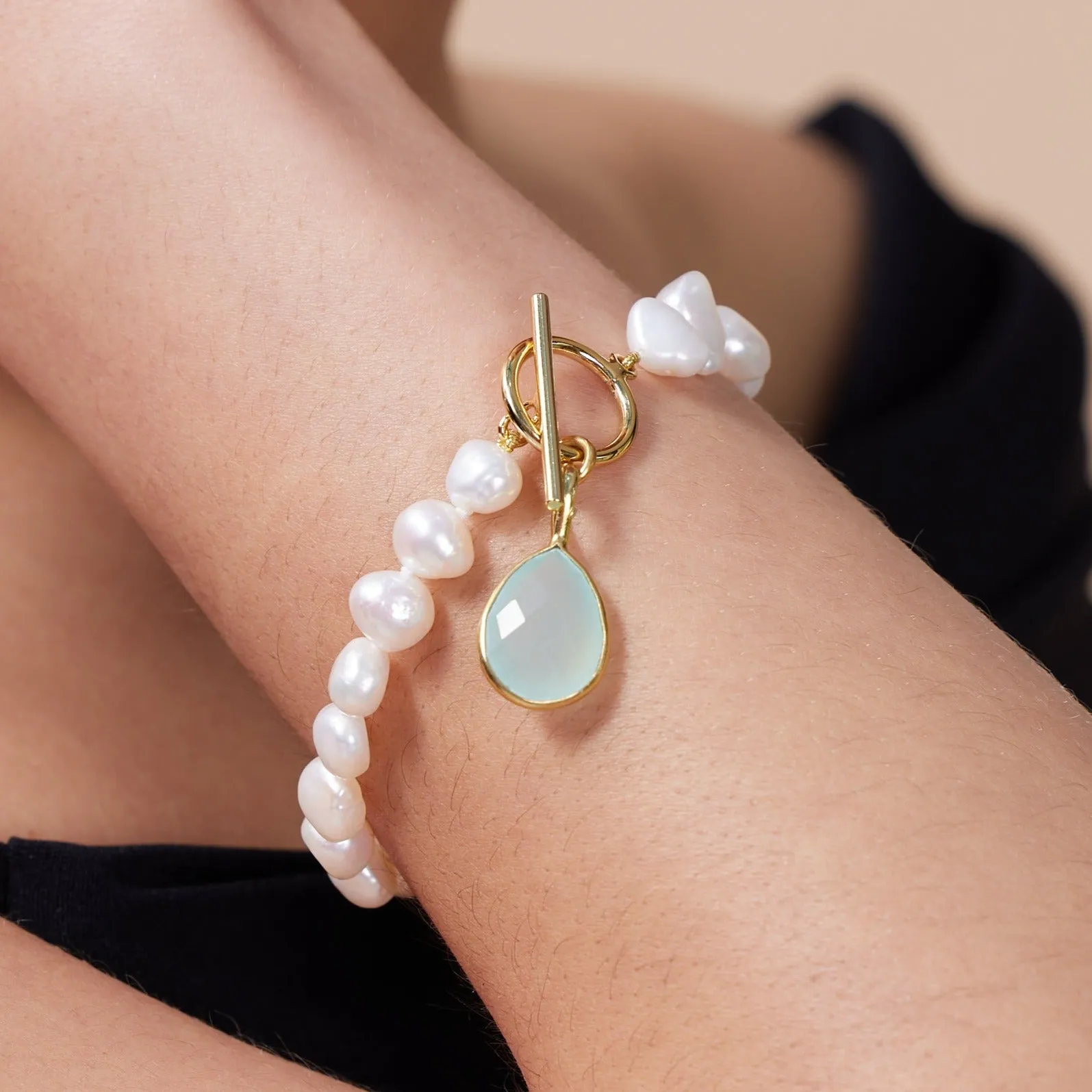 Clara white irregular cultured freshwater pearl bracelet with an aqua chalcedony drop pendant